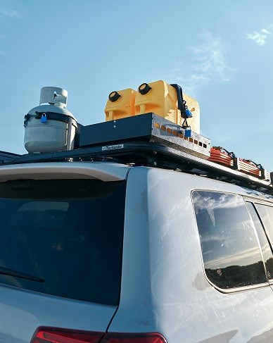 Toyota Landcruiser vehicle with a box on top for a car Roof Rack